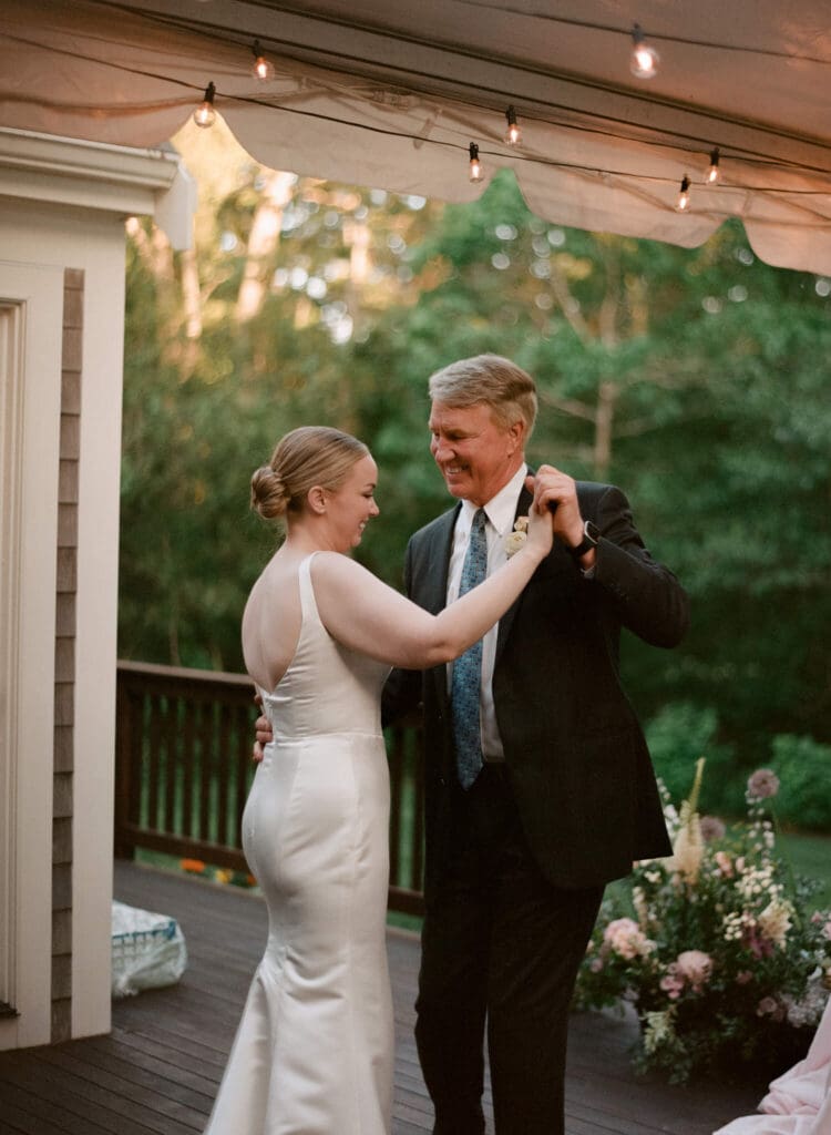 Bride dances with father at small backyard wedding in Massachusetts