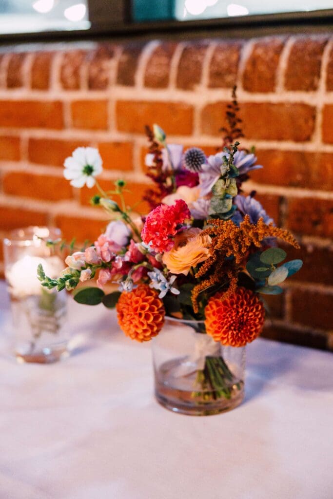 Bridal bouquet in rich burgundy, blush, and rust hues designed for an autumn wedding