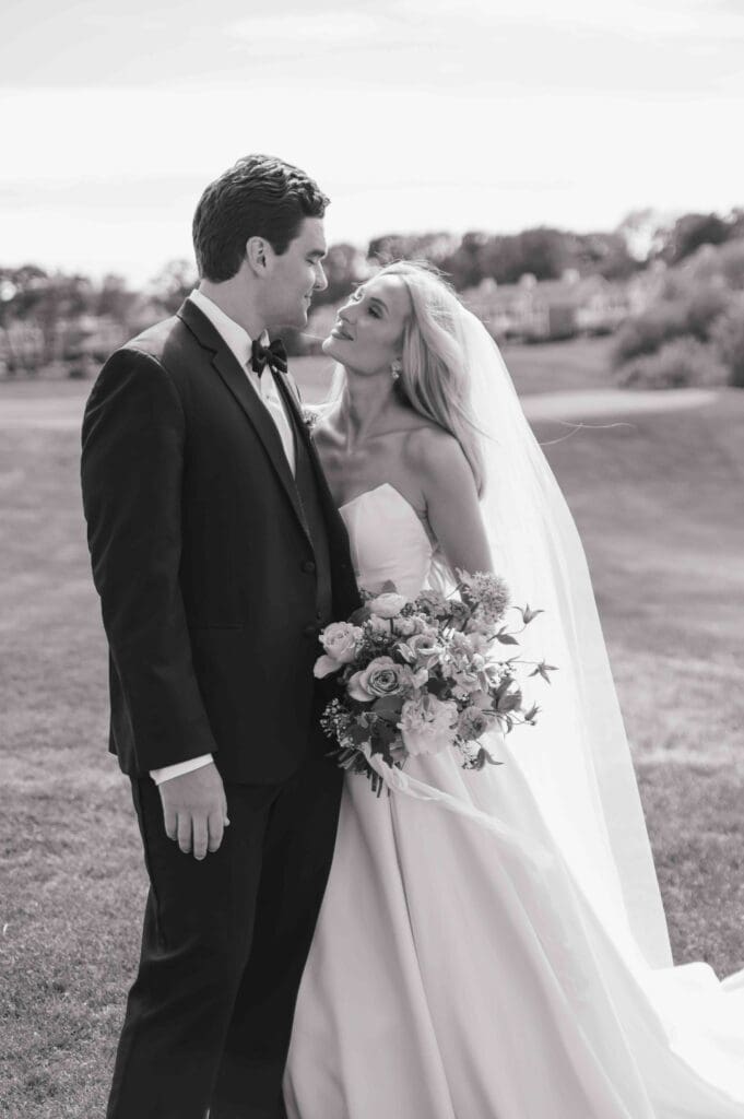 Bride and groom looking at each other lovingly during their Cape Cod wedding at New Seabury Country Club.